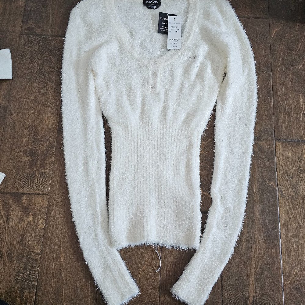 Bebe cream sweater with tag